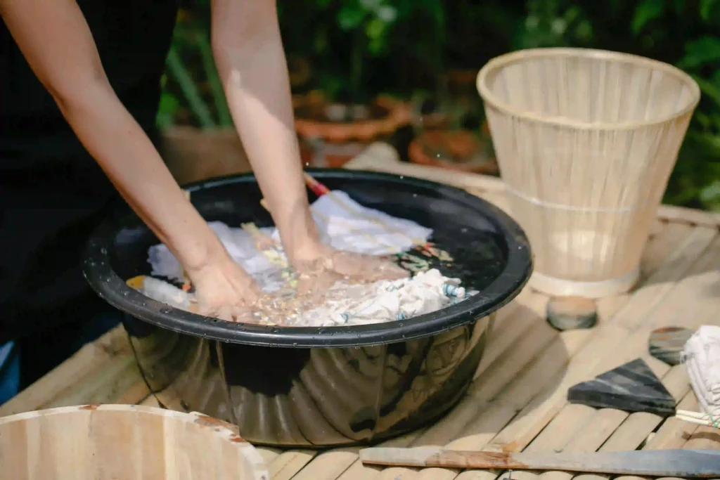 Washing clothes by hand